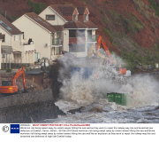 Workman risk being swept away by violent waves hitting the sea wall as they work to repair the railway way line and breached sea defences at Dawlish, Devon, Britain - 08 Feb 2014