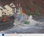Workman risk being swept away by violent waves hitting the sea wall as they work to repair the railway way line and breached sea defences at Dawlish, Devon, Britain - 08 Feb 2014