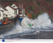 Workman risk being swept away by violent waves hitting the sea wall as they work to repair the railway way line and breached sea defences at Dawlish, Devon, Britain - 08 Feb 2014