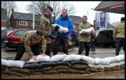 Prince William and Harry put snadbags out in the floods