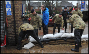 Prince William and Harry put snadbags out in the floods