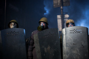 Anti-government protesters clash with the police in Kiev