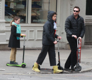 Hugh Jackman and Family Riding Scooters to Church
