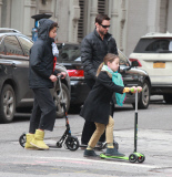 Hugh Jackman and Family Riding Scooters to Church