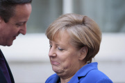 DAVID CAMERON GREETING ANGELA MERKEL ARRIVING TO DOWNING STREET IN LONDON
