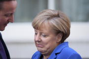 DAVID CAMERON GREETING ANGELA MERKEL ARRIVING TO DOWNING STREET IN LONDON
