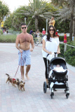 Simon Cowell and Lauren Silverman take a beachside stroll with baby Eric