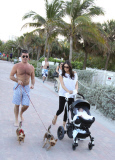 Simon Cowell and Lauren Silverman take a beachside stroll with baby Eric