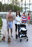 Simon Cowell and Lauren Silverman take a beachside stroll with baby Eric