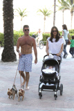 Simon Cowell and Lauren Silverman take a beachside stroll with baby Eric