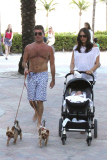 Simon Cowell and Lauren Silverman take a beachside stroll with baby Eric