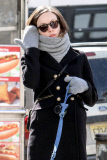 Olivia Wilde gets bundled up to walk Paco