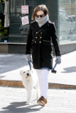 Olivia Wilde gets bundled up to walk Paco