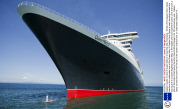 Captain stands on bow of Queen Mary 2 cruise ship, Bali, Indonesia - 02 Mar 2014