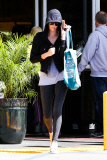 Charlize Theron covers up as she leaves her yoga class
