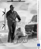 PRINCE KARIM AGA KHAN IV AND BEGUM SALIMA WALKING ON A FROZEN LAKE, ST MORITZ, SWITZERLAND - 1970