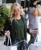 Platinum-blonde Hilary Duff binges at Intermix