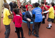  Prince Harry on a swing with local school children from Gainsborough Primary school in Newham at the new Queen Elizabeth Olympic Park, with the Mayor of London, Boris Johnson. The park will open to the public on Saturday 5th April. 14