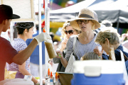 Julie Bowen gets a taste of some Shaved Ice at the Farmers Market