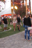 Rosie Huntington-Whiteley holds the hand of another man at Coachella