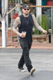 Joel Madden shows off his inked body