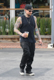 Joel Madden shows off his inked body