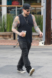 Joel Madden shows off his inked body