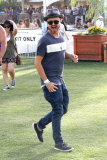 Aaron Paul checks out the different stages at Coachella