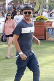 Aaron Paul checks out the different stages at Coachella