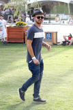 Aaron Paul checks out the different stages at Coachella