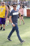 Aaron Paul checks out the different stages at Coachella