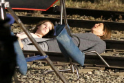 *EXCLUSIVE* Jennifer Aniston and Anna Kendrick film intense scene laying on railroad tracks