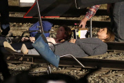 *EXCLUSIVE* Jennifer Aniston and Anna Kendrick film intense scene laying on railroad tracks
