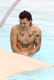 Harry Styles shows off his tattoo-filled body in Brazil