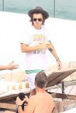 Harry Styles shows off his tattoo-filled body in Brazil