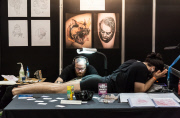 The Great British Tattoo Show at Alexandra Palace, London, 2014.  Tattoo Artists and enthusiasts at the UK's largest tattoo show.  More than 350 tattoo artists.  Also has shows including wrestling, Zombie Boy, Megan Daniels, Jamiroquai trubute Space Cowbo
