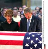 Washington: President  GW Bush and Laura Bush pay their respects at the Coffin of President Ronald Reagan