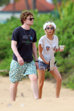 Emma Roberts and Evan Peters take a romantic stroll down the beach in Hawaii