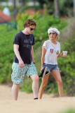 Emma Roberts and Evan Peters take a romantic stroll down the beach in Hawaii