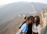First Lady Michelle Obama hugs daughters..........
