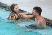 Ryan Phillippe and Paulina Slagter take a dip in the pool