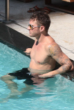 Ryan Phillippe and Paulina Slagter take a dip in the pool