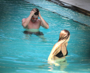 Ryan Phillippe and Paulina Slagter take a dip in the pool