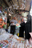 A Palestinian man sells decore lights in his shop at a market in the West Bank City of Ramallah