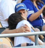 Mila Kunis and Ashton Kutcher take Mila's Baby Bump dressed in Dodgers blue to L.A. Dodgers Baseball Game