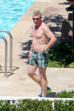 Joe Simpson soaks up the sun with a much younger man before Jessica's Wedding