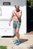Joe Simpson soaks up the sun with a much younger man before Jessica's Wedding