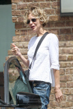A frail-looking Meg Ryan manages to give a thumbs up