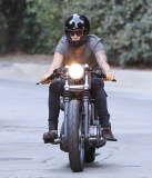PREMIUM EXCL Harry Styles riding his motorcycle