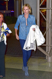 *EXCLUSIVE* *WEB EMBARGO UNTIL 3AM PST 07/25/14** Charlize Theron shows off her engagement ring at LAX! **MUST CALL FOR PRICING** **NO WEB**